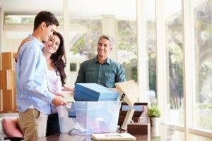 parents helping teen pack for college