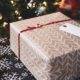 A gift wrapped box tied with a red ribbon.
