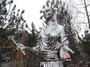 The silver White Witch statue holding Turkish delight at the C.S. Lewis Square in Belfast
