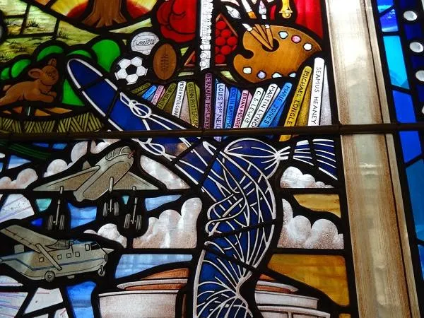 Section of a stained glass window in Belfast City Hall featuring C.S. Lewis - a spot off the beaten C.S. Lewis trail in Belfast
