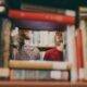 smiling in the library by josh felise