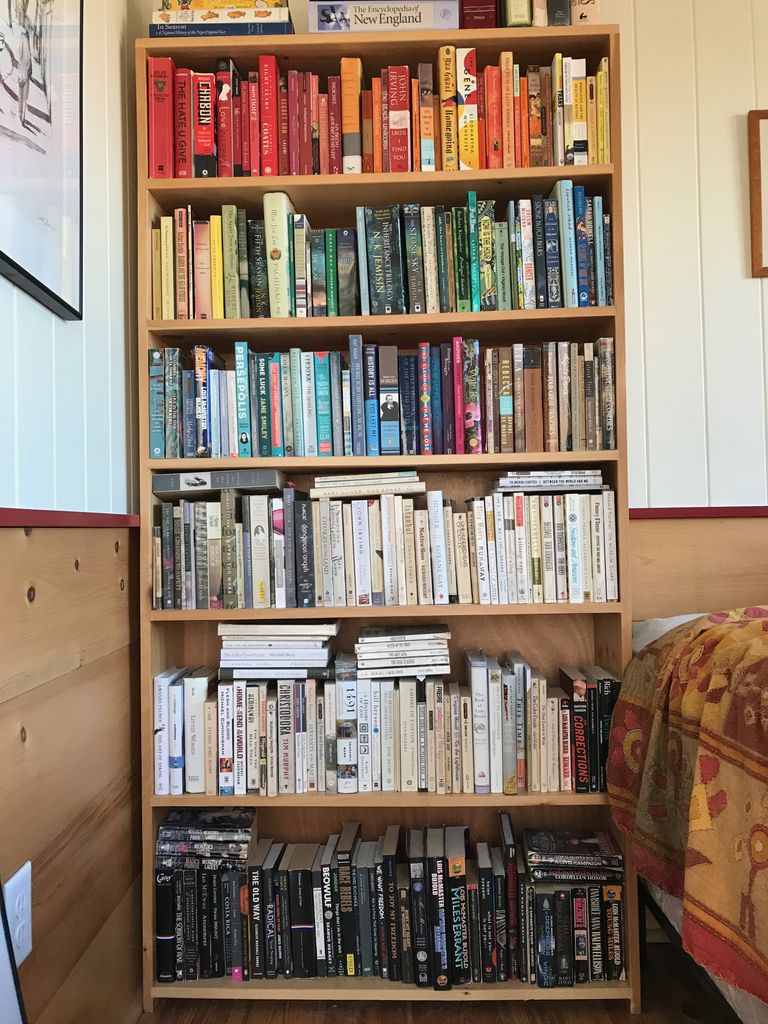 A tall bookcase full of books.
