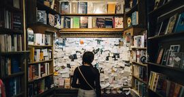 Image of a girl in a bookstore for post about literary tourism in buffalo, new york