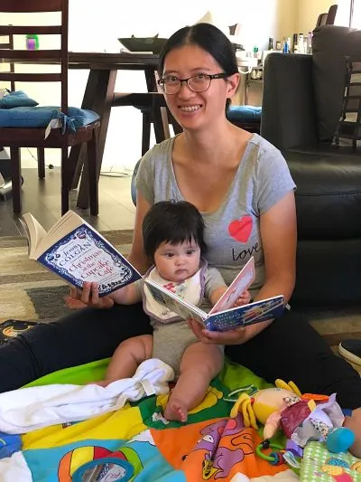 Contributor Jen Sherman reads with her child, shared in celebration of bookish moms for Mother's Day