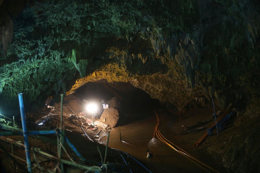 Photo of entrance to cave with spotlight shining