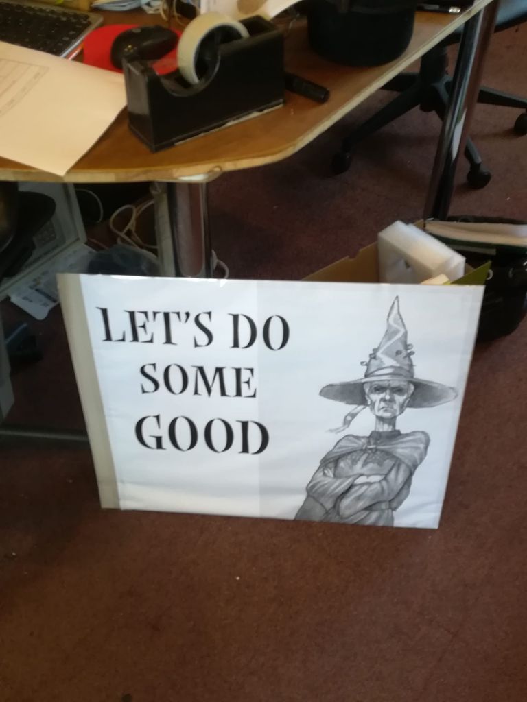 Protest sign featuring Granny Weatherwax and the words 'Let's do some good'