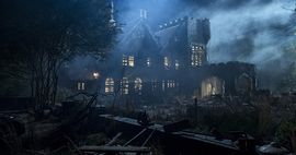 Promotional image of Hill House from the Netflix series. A large, run-down, spooky house, surrounded by fog.