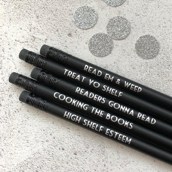 Set of five solid black pencils with bookish phrases in silver