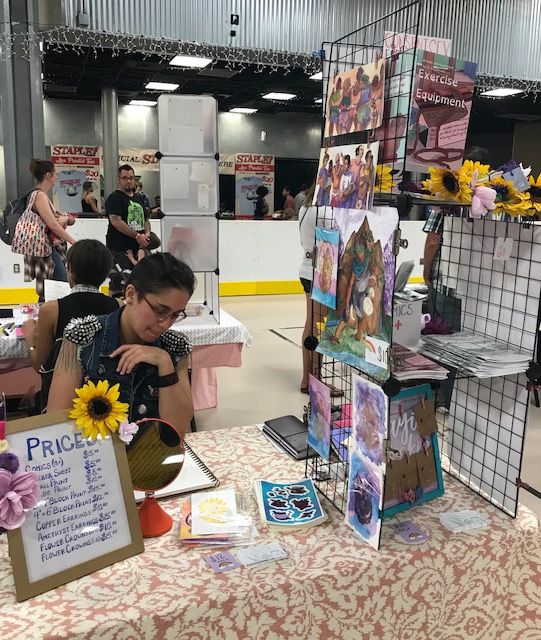 Alex Grandstaff displays their comics and art at STAPLE! 2018