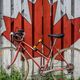 bike leaning against Canadian leaf