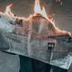 burning newspaper bad news feature