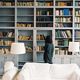 Woman looking at shelf of books