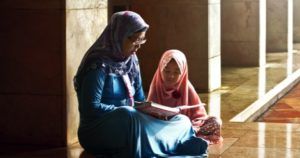 muslim mother reading to daughter children's book feature