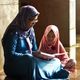 muslim mother reading to daughter children's book feature