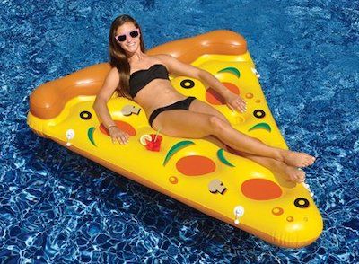 Image of a beach float in the shape of a slice of pizza. 