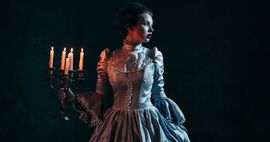victorian woman holding candelabra historical fiction mystery thriller and crime feature
