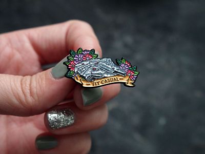 Floral Millennium Falcon enamel pin with the text 'Fly Casual'