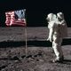Astronaut Buzz Aldrin, Lunar Module pilot of the first lunar landing mission, poses for a photograph beside the deployed United States flag during an Apollo 11 Extravehicular Activity (EVA) on the lunar surface public domain
