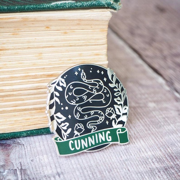 Snake badge that says cunning enamel pin