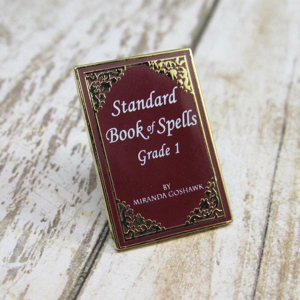 Standard book of spells grade 1 book cover enamel pin
