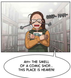 girl with glasses clutching book, saying "Ah, the smell of a comic shop-this place is heaven!"