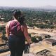Brunette with a book looking over a view
