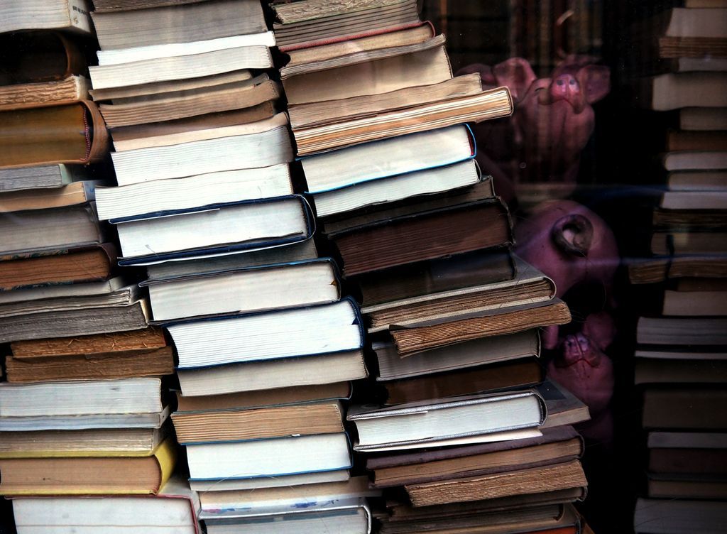Photo of stacks of books by Ali Bong via Unsplash