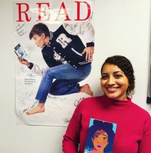 Alex Sheppard in front of David Bowie Poster