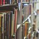 image of books on a shelf at a library