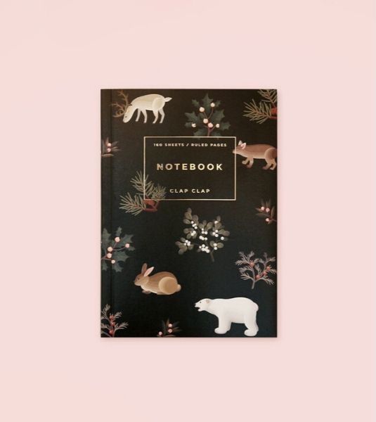 Black notebook with animal and plant illustrations