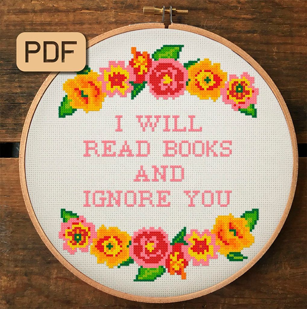 Cross stitch of a floral pattern with "I will read books and ignore you"