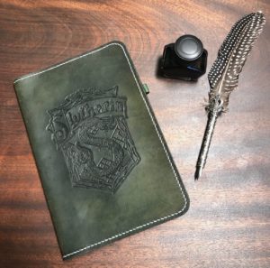 leather notebook portfolio with Slytherin crest