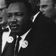 Source: https://en.wikipedia.org/wiki/Martin_Luther_King_Jr.#/media/File:Civil_Rights_March_on_Washington,_D.C._(Dr._Martin_Luther_King,_Jr._and_Mathew_Ahmann_in_a_crowd.)_-_NARA_-_542015_-_Restoration.jpg