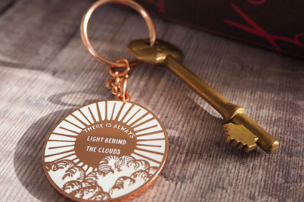 Light Behind the Clouds Keyring from All The LITTLE WOMEN Etsy Finds | bookriot.com