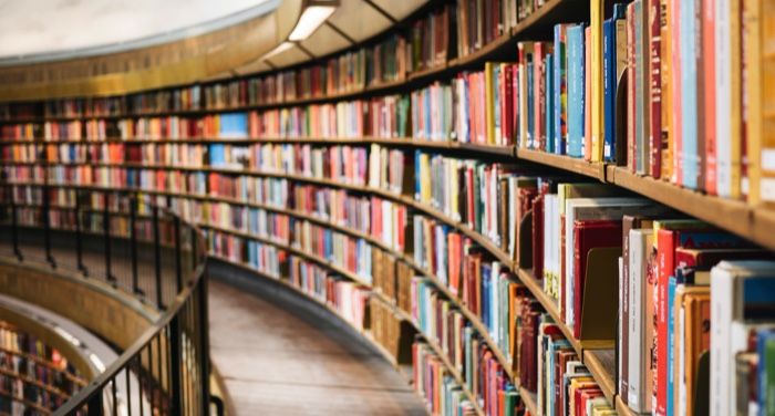 a photo of bookshelves at a library