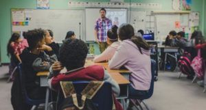 a photo of someone teaching in a classroom