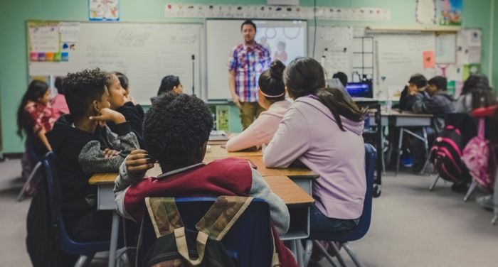 a photo of someone teaching in a classroom