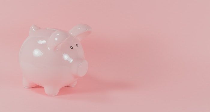 Image of a pink piggy bank on a pink background
