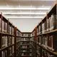 a photo of an aisle in a school library