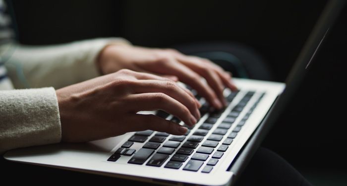 hands typing on a laptop computer https://unsplash.com/photos/vZJdYl5JVXY