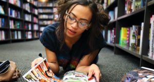 young woman reading comics feature