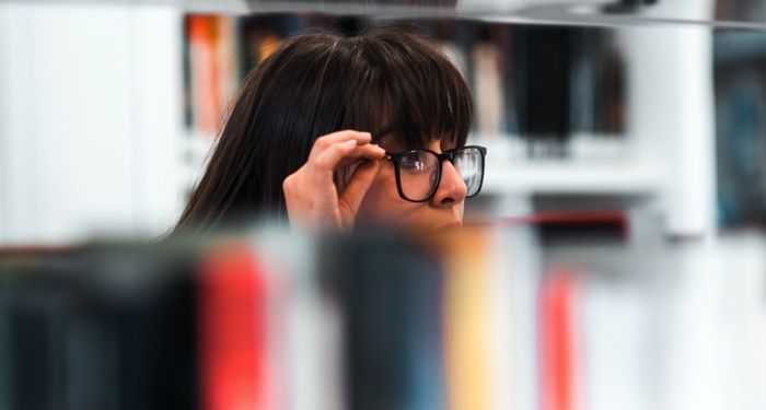 a photo of a person browsing in a bookstore