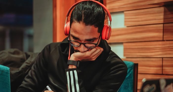 a photo of someone listening to headphones