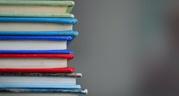 spines of a stack of books https://unsplash.com/photos/lUaaKCUANVI