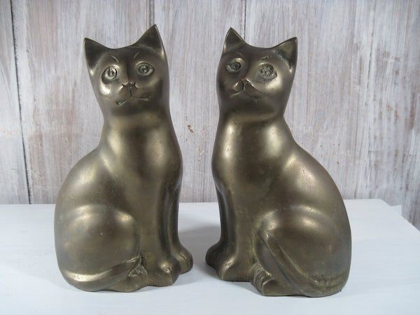Brass cats. Image from Etsy shop.