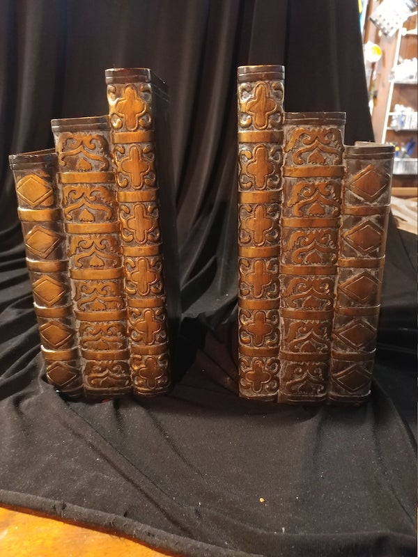 Bookends made out of bronze books. Image from Etsy shop.