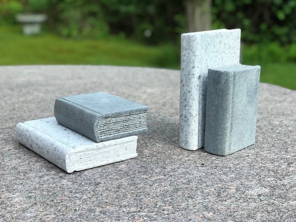 Hand-carved granite books. Image from Etsy shop.