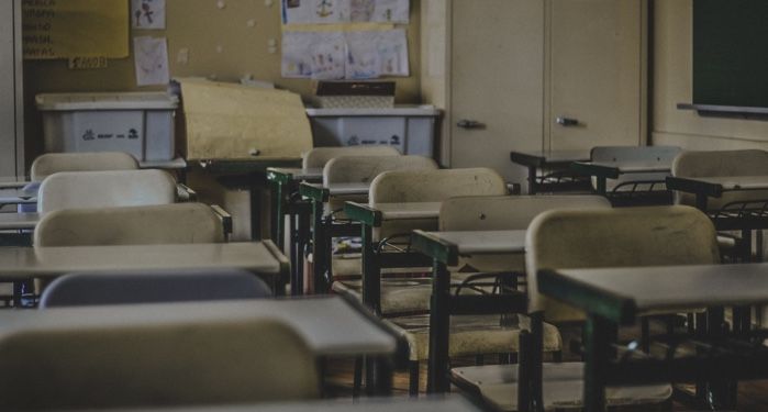 a photo of desks in a classroom