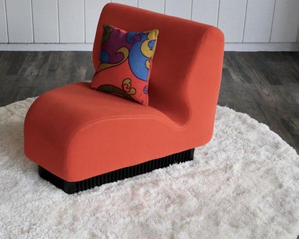 red orange wedge chair