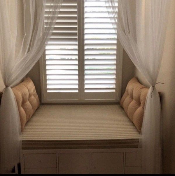 window nook with bench and side cushions